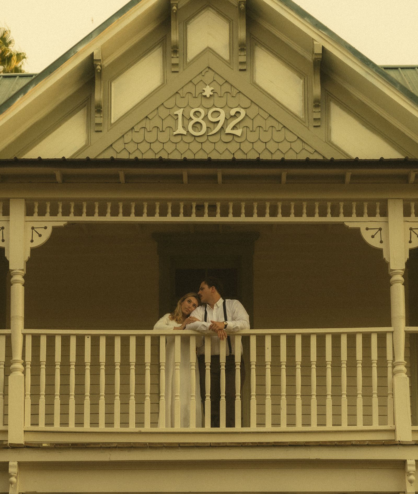A couple on the upstairs balcony