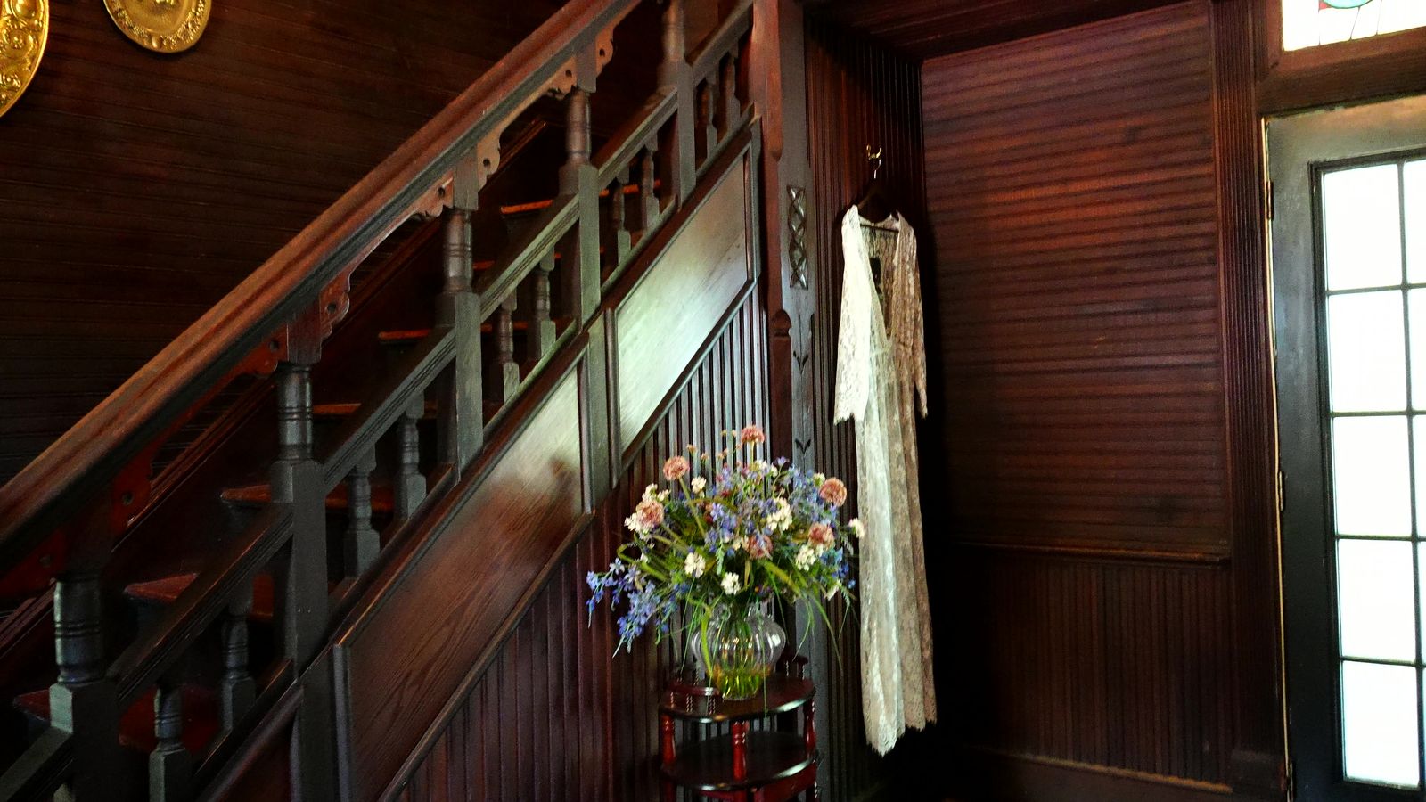 A dress hanging by the staircase